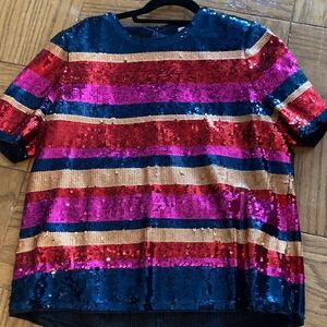 Tina Turk sequined short-sleeved top.
Perfect for a fun evening out.